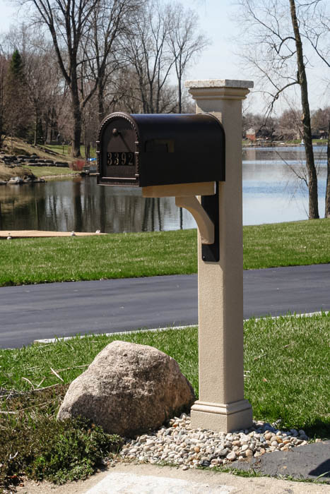 modern mailbox post with textured finish, granite post cap, and black bracket